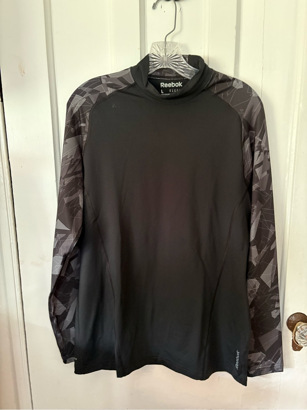 Reebok Black Athletic Crewneck Top with Subtle Geometric Detail